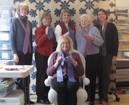 Sewist repairing quilts in the atelier